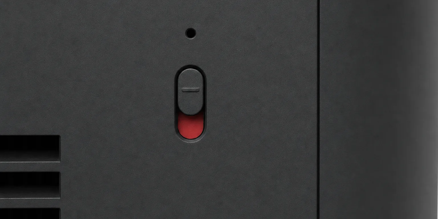 AI-generated concept render of the Nolaka Station, built on our CAD — a macro view of the back panel around the microphone switch, its slider pushed up and a red band showing beneath it, with the vent slots at the lower left.